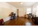 Versatile room with hardwood floors, computer setup, and musical instruments at 400 Collier Rd, Atlanta, GA 30309