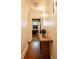 Hallway with a wooden bench and view of office space, creates a welcoming and functional transition at 400 Collier Rd, Atlanta, GA 30309
