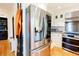 Modern kitchen with stainless steel refrigerator and white cabinets, offering ample storage at 400 Collier Rd, Atlanta, GA 30309