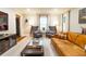Well-lit living room featuring modern furniture, a mounted television, and cozy decor at 400 Collier Rd, Atlanta, GA 30309