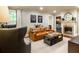Cozy living room with fireplace, comfortable leather sofa, and stylish decor at 400 Collier Rd, Atlanta, GA 30309