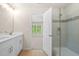 Bathroom featuring double sinks, a glass shower, and views to the bedroom at 5443 Blossomwood Sw Trl, Mableton, GA 30126