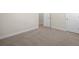 Spacious bedroom featuring neutral carpet and bright white trim around the doors at 5443 Blossomwood Sw Trl, Mableton, GA 30126