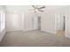 Large bedroom with neutral walls, carpeted floor, ceiling fan, with plenty of natural light at 5443 Blossomwood Sw Trl, Mableton, GA 30126