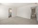Carpeted bedroom with ensuite bathroom and closet at 5443 Blossomwood Sw Trl, Mableton, GA 30126