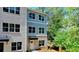 Charming exterior with brick and blue siding, large windows, and well-maintained landscaping at 5443 Blossomwood Sw Trl, Mableton, GA 30126