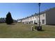 Expansive backyard surrounded by well-maintained townhomes, offering a serene outdoor space at 7238 April Ct, Morrow, GA 30260