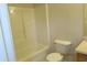 A bright bathroom featuring a tub, toilet, and vanity at 7238 April Ct, Morrow, GA 30260