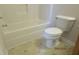 This bathroom features a bathtub, toilet, and neutral vinyl flooring at 7238 April Ct, Morrow, GA 30260