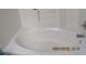 Bright bathroom with a full bathtub and updated fixtures at 7238 April Ct, Morrow, GA 30260