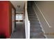 Entryway with carpeted stairs and view into the living room at 7238 April Ct, Morrow, GA 30260
