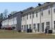 Charming multi-Gathering homes featuring vinyl siding and private patios overlooking a spacious backyard at 7238 April Ct, Morrow, GA 30260