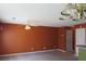 Living room with ceiling fan, large window and view into the kitchen at 7238 April Ct, Morrow, GA 30260