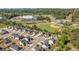Aerial view of homes near community school with baseball field and track, offering convienient Gathering lifestyle at 100 Cottage Nw Walk, Cartersville, GA 30121