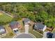 Aerial view of the charming two-story home with a lush, green backdrop and well-maintained lawn at 100 Cottage Nw Walk, Cartersville, GA 30121