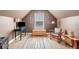Finished attic space with carpet floors, built-in shelves, and furniture at 100 Cottage Nw Walk, Cartersville, GA 30121