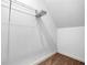Attic space with carpet flooring and hanging shelves provides additional storage options at 100 Cottage Nw Walk, Cartersville, GA 30121