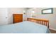 Comfortable bedroom with carpet, wooden dresser, and a connecting door to the bathroom at 100 Cottage Nw Walk, Cartersville, GA 30121