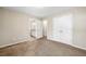 Bedroom with carpet and a connecting bathroom, and double door closet, providing plenty of space at 100 Cottage Nw Walk, Cartersville, GA 30121