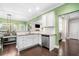 Well-lit kitchen with white cabinets, stainless steel appliances, granite countertops, and access to other living spaces at 100 Cottage Nw Walk, Cartersville, GA 30121