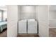 Convenient laundry closet with included washer and dryer appliances and extra storage space at 100 Cottage Nw Walk, Cartersville, GA 30121