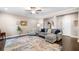 Spacious living room with hardwood floors, area rug, a comfortable sofa, and natural light at 100 Cottage Nw Walk, Cartersville, GA 30121