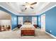 Cozy main bedroom with tray ceilings, carpet floors, with a king bed at 100 Cottage Nw Walk, Cartersville, GA 30121
