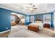 Spacious main bedroom featuring a sitting area, carpet floors, with a king bed at 100 Cottage Nw Walk, Cartersville, GA 30121