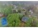 Neighborhood aerial showing mature trees, landscaping, and nearby amenities at 4272 Glenlake Nw Dr, Kennesaw, GA 30144