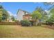 Charming home featuring a spacious backyard, a wooden fence, and a cozy deck at 4272 Glenlake Nw Dr, Kennesaw, GA 30144