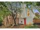 Two-story house featuring a deck, a bright red door, and lush landscaping at 4272 Glenlake Nw Dr, Kennesaw, GA 30144