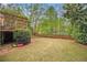 Expansive backyard with a manicured lawn and inviting back deck at 4272 Glenlake Nw Dr, Kennesaw, GA 30144