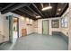 Open basement area with a painted floor and unfinished ceiling at 4272 Glenlake Nw Dr, Kennesaw, GA 30144