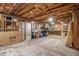 Unfinished basement featuring exposed ceiling beams, concrete floors, and open storage area at 4272 Glenlake Nw Dr, Kennesaw, GA 30144