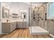 Bright bathroom featuring a walk-in shower with modern fixtures, double vanities, and wood-look tile at 4272 Glenlake Nw Dr, Kennesaw, GA 30144