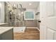 Modern bathroom featuring a walk-in shower with stylish fixtures and a window for natural light at 4272 Glenlake Nw Dr, Kennesaw, GA 30144