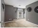 Bedroom with gray walls, carpet, and modern decor at 4272 Glenlake Nw Dr, Kennesaw, GA 30144