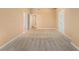 Empty bedroom featuring neutral carpet, and several closets at 4272 Glenlake Nw Dr, Kennesaw, GA 30144