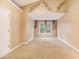 Bedroom featuring vaulted ceilings, neutral carpet, and a window view at 4272 Glenlake Nw Dr, Kennesaw, GA 30144
