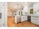 Bright kitchen features white cabinets, stainless steel appliances, granite countertops, and wine cooler at 4272 Glenlake Nw Dr, Kennesaw, GA 30144