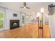 Spacious living room with hardwood floors, modern light fixtures, and an open view of the modern kitchen at 4272 Glenlake Nw Dr, Kennesaw, GA 30144