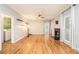 Open-concept living room features hardwood floors, fireplace, and ample natural light with neutral tones at 4272 Glenlake Nw Dr, Kennesaw, GA 30144