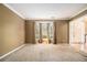 Cozy living room features neutral carpet, bay window, and view of the front entry at 4272 Glenlake Nw Dr, Kennesaw, GA 30144