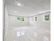 Finished basement with bright lighting, paneled walls, and windows at 851 Rockbridge Sw Rd, Lilburn, GA 30047