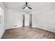 Bedroom features wood-look floors, ceiling fan and a closet for storage at 851 Rockbridge Sw Rd, Lilburn, GA 30047