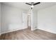 Bedroom with wood-look floors with a view into the entryway and closet at 851 Rockbridge Sw Rd, Lilburn, GA 30047