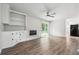 Spacious living room with wood-burning fireplace and sliding glass doors at 851 Rockbridge Sw Rd, Lilburn, GA 30047