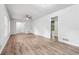 Expansive living room featuring sleek floors, recessed lighting, and freshly painted white walls at 851 Rockbridge Sw Rd, Lilburn, GA 30047