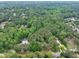 Lush green trees surround this beautiful neighborhood, offering peace and serenity at 881 Rockbridge Sw Rd, Lilburn, GA 30047