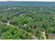 Lush green trees surround this beautiful neighborhood, offering peace and serenity at 881 Rockbridge Sw Rd, Lilburn, GA 30047